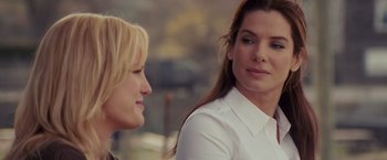 Movie still from “The Proposal” (2009), directed by Anne Fletcher – Two women are talking to each other outside; Close Up shot, Over the shoulder angle