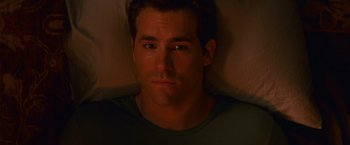 Movie still from “The Proposal” (2009), directed by Anne Fletcher – A person laying in a bed; Close Up shot, High angle