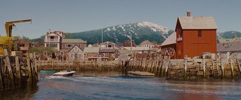 Movie still from “The Proposal” (2009), directed by Anne Fletcher – A view of a harbor with a mountain in the background; Extreme Wide shot, High angle