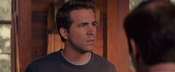 Movie still from “The Proposal” (2009), directed by Anne Fletcher – A person looking at something; Close Up shot, Over the shoulder angle