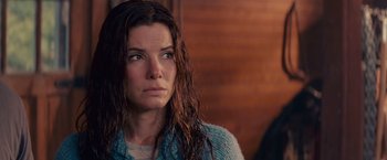 Movie still from “The Proposal” (2009), directed by Anne Fletcher – A person with wet hair; Close Up shot, Over the shoulder angle