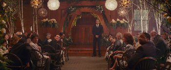 Movie still from “The Proposal” (2009), directed by Anne Fletcher – A man standing in front of a group of people; Wide shot, Over the shoulder angle