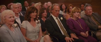 Movie still from “The Proposal” (2009), directed by Anne Fletcher – A group of people sitting next to each other in a room; Medium shot, Over the shoulder angle