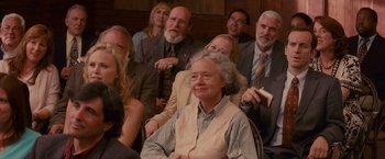 Movie still from “The Proposal” (2009), directed by Anne Fletcher – A group of people sitting in a room; Medium shot, Over the shoulder angle