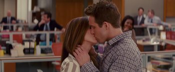 Movie still from “The Proposal” (2009), directed by Anne Fletcher – A man and a woman kissing each other; Close Up shot, Over the shoulder angle