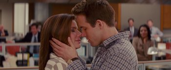 Movie still from “The Proposal” (2009), directed by Anne Fletcher – A man and a woman are kissing each other; Close Up shot, Over the shoulder angle