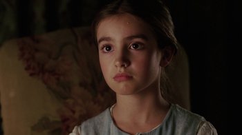 Movie still from “Ella Enchanted” (2004), directed by Tommy O'Haver – A young girl is sitting in a chair looking at the camera; Close Up shot, High angle