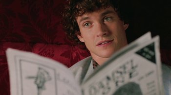 Movie still from “Ella Enchanted” (2004), directed by Tommy O'Haver – A person reading a book; Close Up shot, High angle