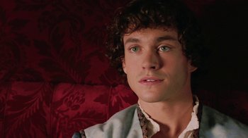 Movie still from “Ella Enchanted” (2004), directed by Tommy O'Haver – A person sitting on a couch; Close Up shot, High angle