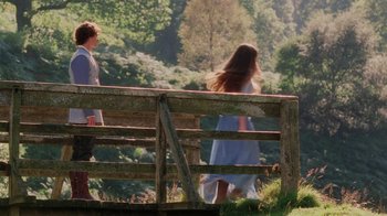 Movie still from “Ella Enchanted” (2004), directed by Tommy O'Haver – Two people are walking on a wooden bridge; Wide shot, Over the shoulder angle