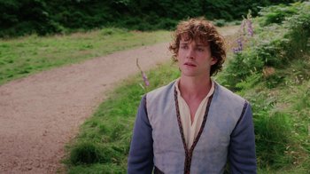 Movie still from “Ella Enchanted” (2004), directed by Tommy O'Haver – A young man standing on a dirt path; Close Up shot, High angle