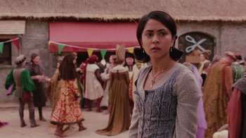 Movie still from “Ella Enchanted” (2004), directed by Tommy O'Haver – A woman standing in front of a group of people; Close Up shot, Over the shoulder angle
