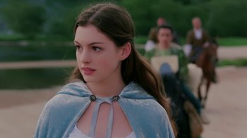 Movie still from “Ella Enchanted” (2004), directed by Tommy O'Haver – A woman with long hair wearing a blue cape; Close Up shot, Over the shoulder angle