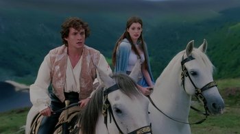 Movie still from “Ella Enchanted” (2004), directed by Tommy O'Haver – A man and a woman riding on the back of a white horse; Medium shot, Low angle