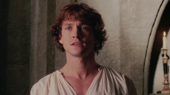 Movie still from “Ella Enchanted” (2004), directed by Tommy O'Haver – A man with long brown hair wearing a white shirt; Close Up shot, Over the shoulder angle