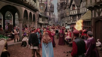 Movie still from “Ella Enchanted” (2004), directed by Tommy O'Haver – A group of people standing in the middle of a street; Wide shot, High angle