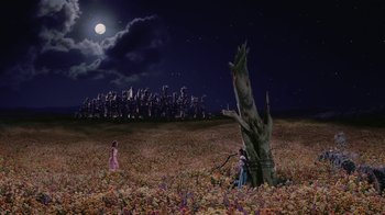Movie still from “Ella Enchanted” (2004), directed by Tommy O'Haver – Two people standing in a field at night; Extreme Wide shot, High angle