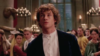 Movie still from “Ella Enchanted” (2004), directed by Tommy O'Haver – A young man in a white shirt and a blue jacket; Close Up shot, Low angle