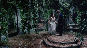 Movie still from “Ella Enchanted” (2004), directed by Tommy O'Haver – A man and a woman are standing in the woods; Wide shot, High angle