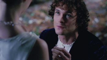 Movie still from “Ella Enchanted” (2004), directed by Tommy O'Haver – A man and a woman sitting in front of each other; Close Up shot, Over the shoulder angle
