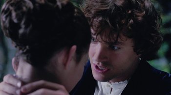 Movie still from “Ella Enchanted” (2004), directed by Tommy O'Haver – A young man with curly brown hair and blue eyes talking to another young man; Close Up shot, Over the shoulder angle