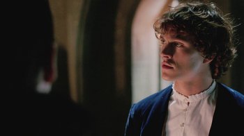Movie still from “Ella Enchanted” (2004), directed by Tommy O'Haver – A man in a blue jacket looking to his left; Close Up shot, Over the shoulder angle