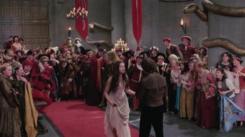 Movie still from “Ella Enchanted” (2004), directed by Tommy O'Haver – A crowd of people standing around a red carpet; Wide shot, High angle