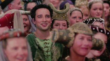 Movie still from “Ella Enchanted” (2004), directed by Tommy O'Haver – A group of people dressed up in costumes; Close Up shot, Over the shoulder angle