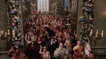 Movie still from “Ella Enchanted” (2004), directed by Tommy O'Haver – A large group of people standing in front of a building; Wide shot, High angle