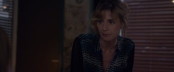 Movie still from “Elle” (2016), directed by Paul Verhoeven – A person wearing a plaid shirt; Close Up shot, Over the shoulder angle