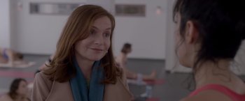 Movie still from “Elle” (2016), directed by Paul Verhoeven – A person wearing a scarf; Close Up shot, Over the shoulder angle