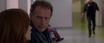 Movie still from “Elle” (2016), directed by Paul Verhoeven – A person wearing a scarf; Close Up shot, Over the shoulder angle