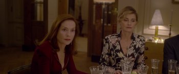 Movie still from “Elle” (2016), directed by Paul Verhoeven – Two women sitting at a table in front of each other; Medium shot, Over the shoulder angle