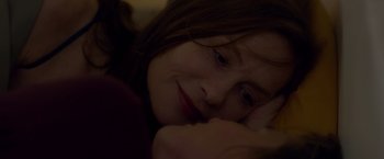 Movie still from “Elle” (2016), directed by Paul Verhoeven – A young girl laying on the ground with her head resting on her hand; Close Up shot, Over the shoulder angle