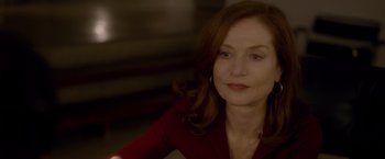 Movie still from “Elle” (2016), directed by Paul Verhoeven – A person wearing a red shirt; Close Up shot, Over the shoulder angle