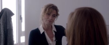 Movie still from “Elle” (2016), directed by Paul Verhoeven – A woman looking at herself in the mirror; Close Up shot, Over the shoulder angle