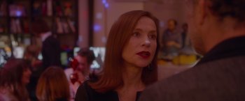 Movie still from “Elle” (2016), directed by Paul Verhoeven – A person with long red hair; Close Up shot, Over the shoulder angle