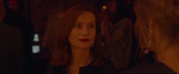 Movie still from “Elle” (2016), directed by Paul Verhoeven – A person wearing a black shirt; Close Up shot, Over the shoulder angle