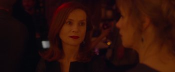 Movie still from “Elle” (2016), directed by Paul Verhoeven – A person wearing a black shirt; Close Up shot, Over the shoulder angle