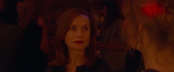 Movie still from “Elle” (2016), directed by Paul Verhoeven – A person wearing a black shirt; Close Up shot, Over the shoulder angle