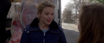 Movie still from “Elle” (2016), directed by Paul Verhoeven – A woman standing on the side of the street; Close Up shot, Over the shoulder angle