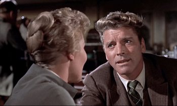 Movie still from “Elmer Gantry” (1960), directed by Richard Brooks – A man and a woman talking to each other; Close Up shot, Over the shoulder angle