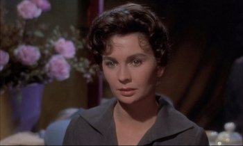 Movie still from “Elmer Gantry” (1960), directed by Richard Brooks – A person with short hair; Close Up shot, Over the shoulder angle