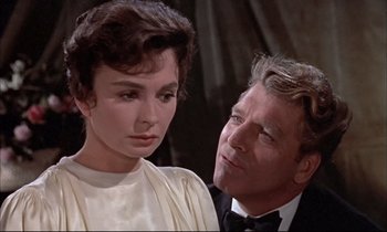Movie still from “Elmer Gantry” (1960), directed by Richard Brooks – An older man and a younger woman in a scene from a movie; Close Up shot, Over the shoulder angle