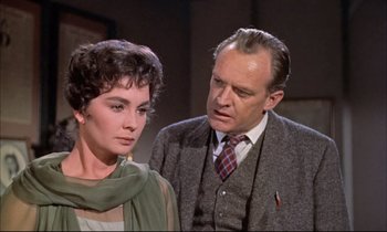Movie still from “Elmer Gantry” (1960), directed by Richard Brooks – An older man and a younger woman standing next to each other; Close Up shot, Over the shoulder angle