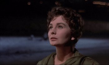 Movie still from “Elmer Gantry” (1960), directed by Richard Brooks – A person with short curly hair; Close Up shot, Low angle