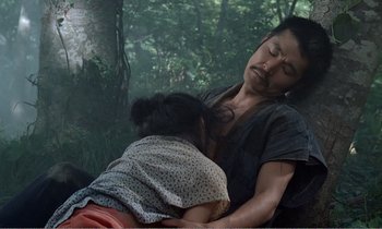 Movie still from “Empire of Passion” (1978), directed by Nagisa Ôshima – A man and a woman are sleeping on a bench; Medium shot, High angle