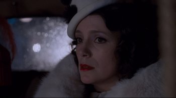 Movie still from “Empire of the Sun” (1987), directed by Steven Spielberg – A person wearing a hat; Close Up shot, Low angle
