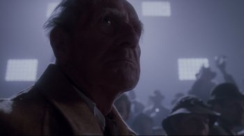 Movie still from “Empire of the Sun” (1987), directed by Steven Spielberg – An old man looking up into the sky; Close Up shot, Low angle