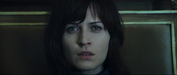 Movie still from “Empire of the Wolves” (2005), directed by Chris Nahon – A woman's face with blue eyes; Close Up shot, High angle